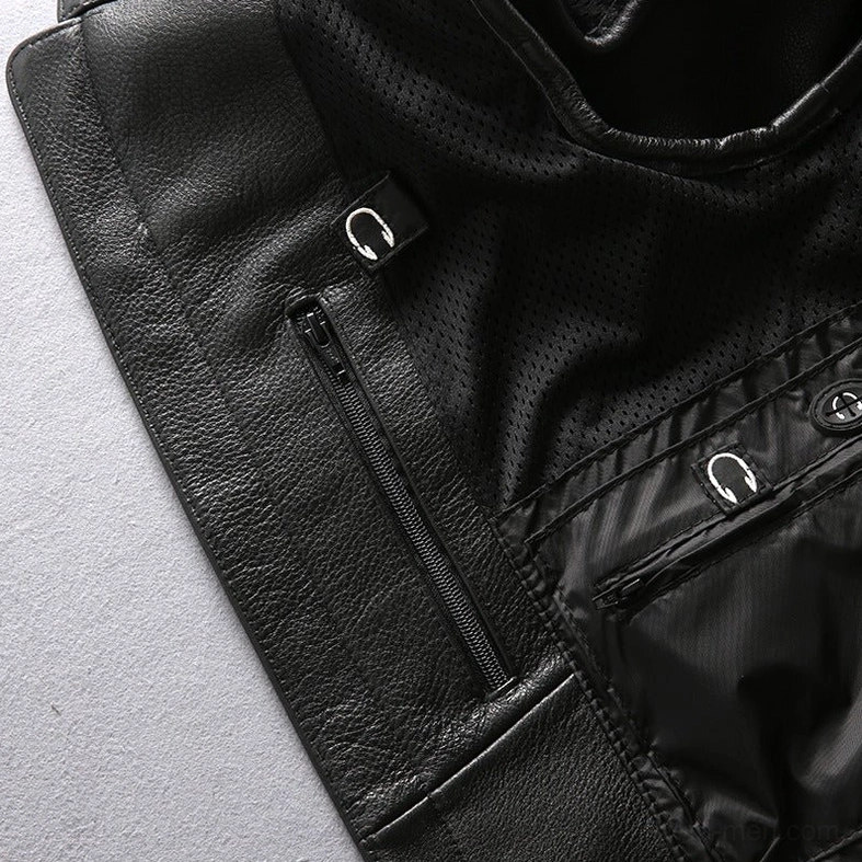 Three-quarter angle of model styling leather motorcycle vest with alternative fashion look