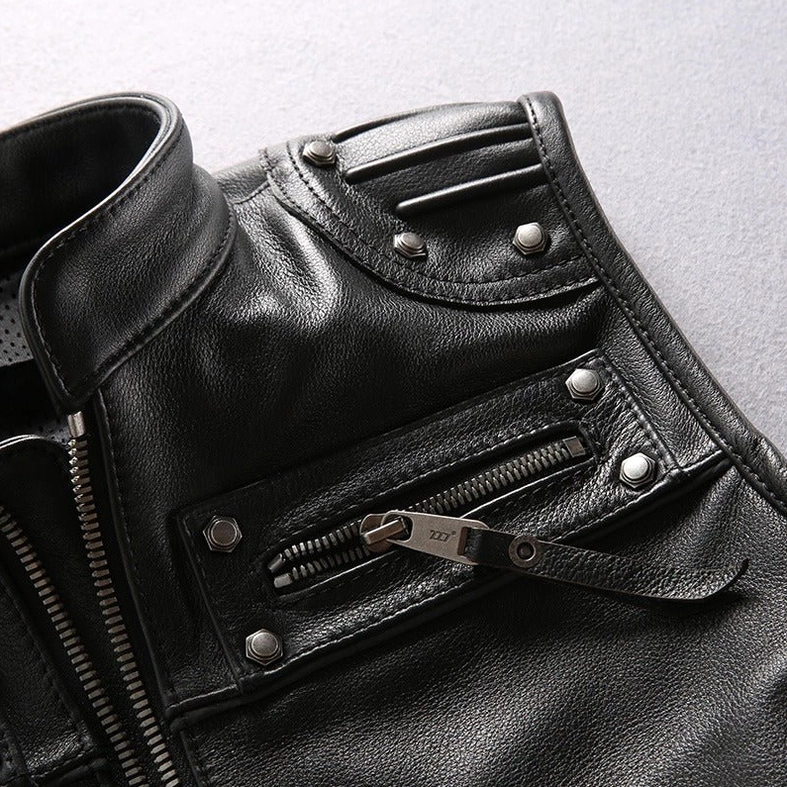 Zipper pulls and rivet fasteners on genuine leather biker vest detail shot