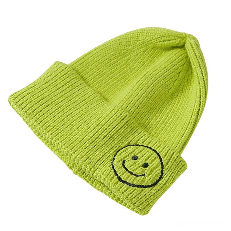 Light green knit beanie with black smiley face embroidery, nature-inspired gothic