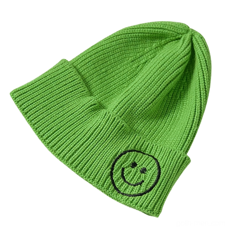 Lime green ribbed knit beanie with black smiley embroidery, bold alternative accessory
