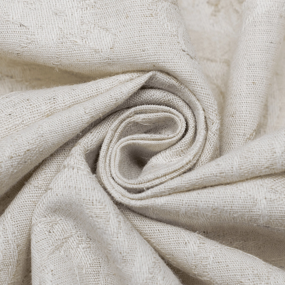 Close-up of thick natural linen weave texture in off-white beige - showing fabric drape and quality
