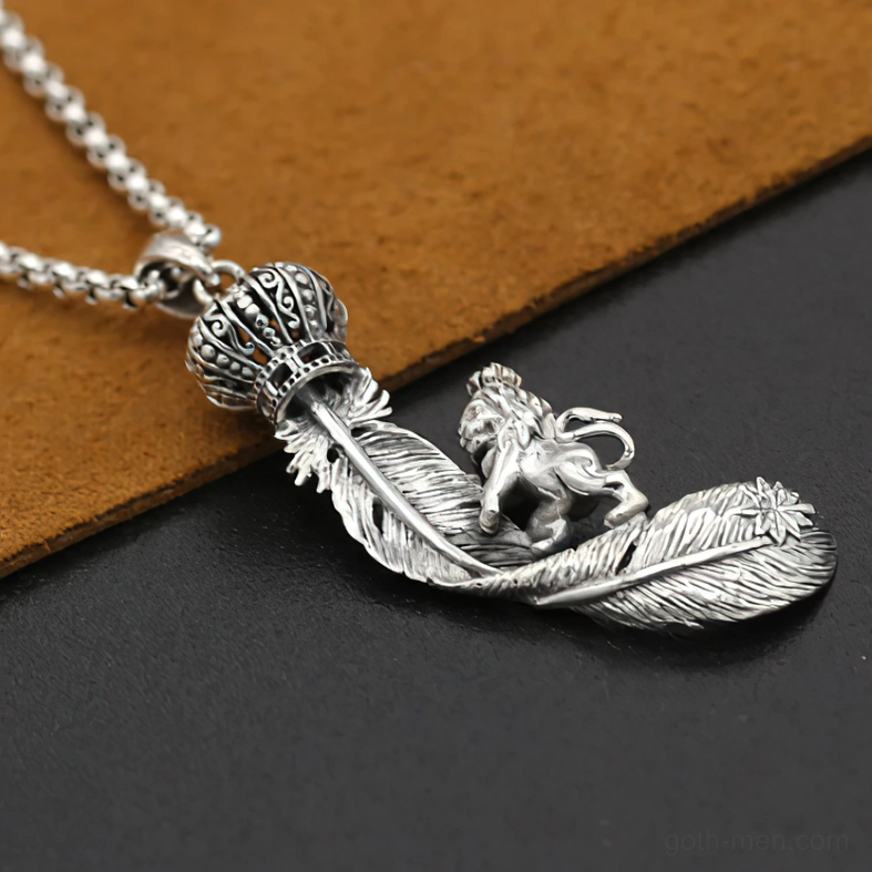 Close-up detail of carved king lion feather pendant vintage silver tone gothic jewelry