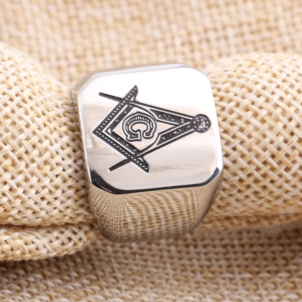 Masonic signet ring detail showing engraved square and compass emblem, stainless steel gothic jewelry craftsmanship