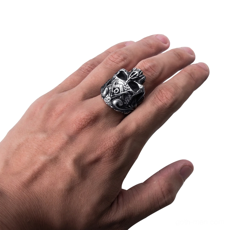 Male hand wearing masonic skull gothic ring on middle finger demonstrating fit and wearable aesthetic