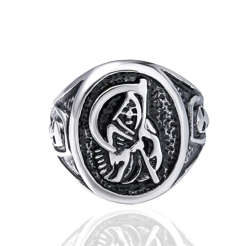 Dual skull accent gothic ring front view showing intricate carving work and memento mori design elements