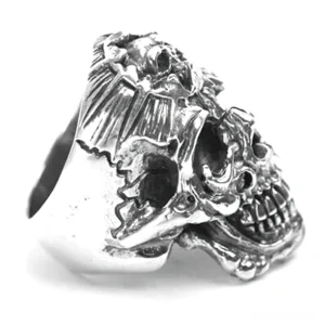 Vintage antique silver skull ring side angle showing weathered distressed detail and band profile