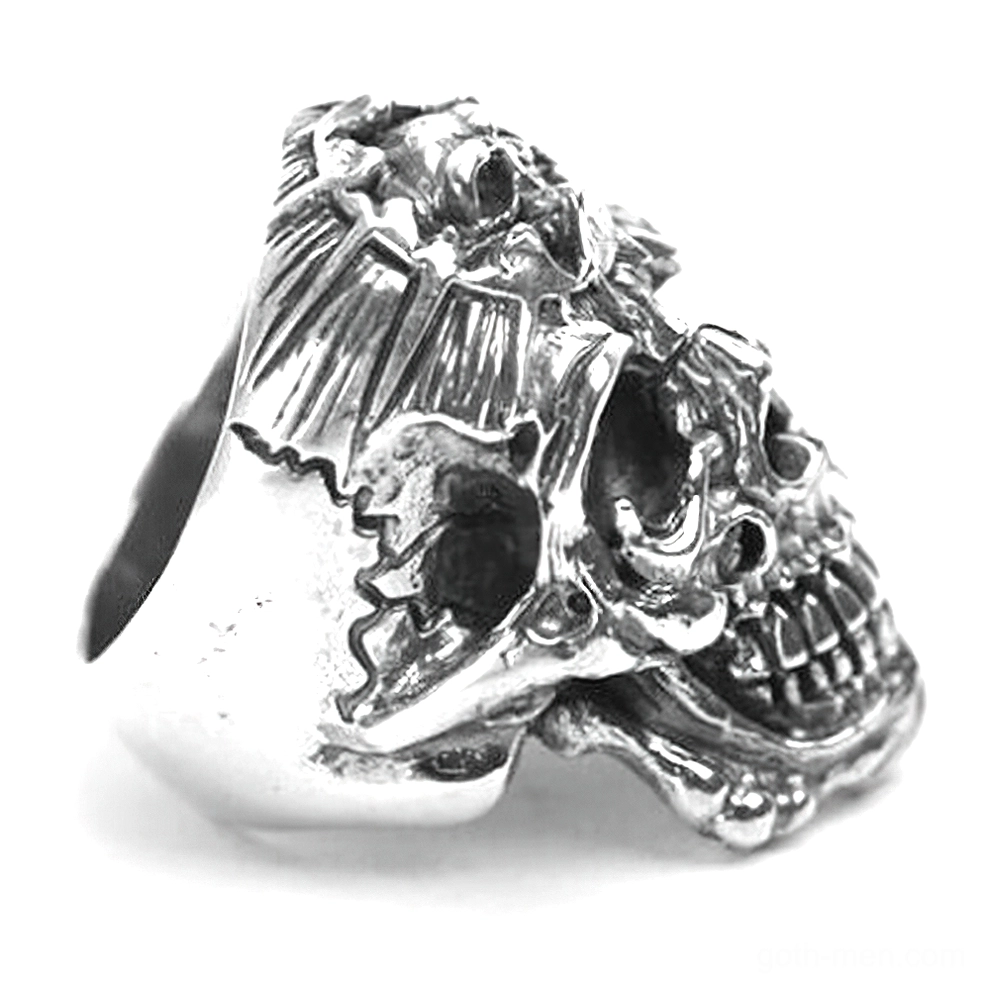 Vintage antique silver skull ring side angle showing weathered distressed detail and band profile