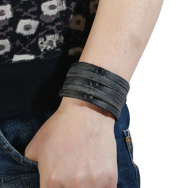 Punk rock leather cuff bracelet worn on male wrist - side perspective showing adjustable fit and casual daily wear styling with alternative fashion