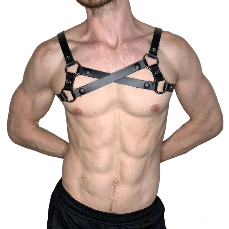 Gothic black leather male chest harness with adjustable metal hardware, hands behind back pose, alternative style body wear