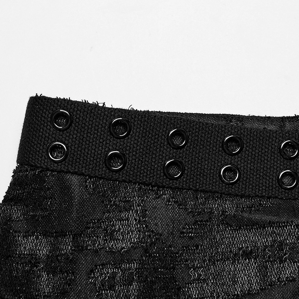 Black studded eyelet shoulder strap close-up - men's gothic tank top woven strap with metal eyelets