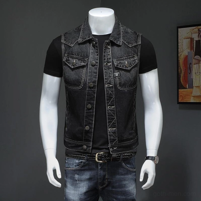 Men's black sleeveless denim gothic biker vest full front view worn with black tee and matching belt accessory