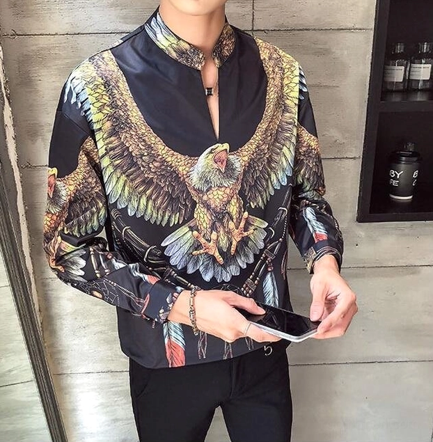 Model wearing black gothic eagle dreamcatcher shirt with detailed tribal print indoor