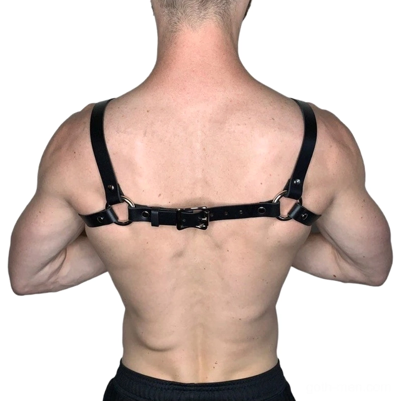 Black leather men's harness rear view showing adjustable back buckle system and strap construction, gothic aesthetic