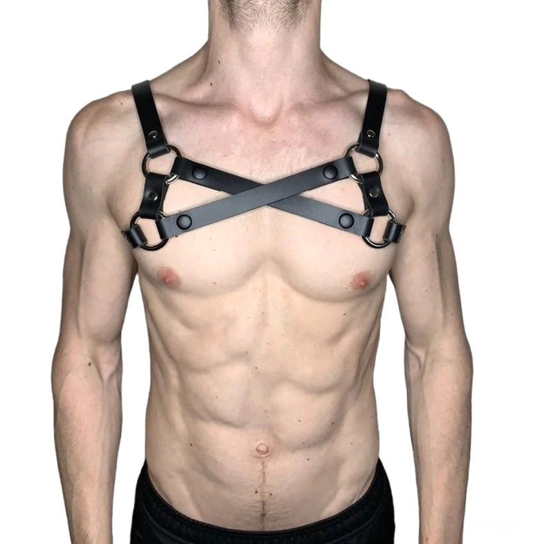 Men's black PU leather harness X-pattern design with metal buckles, front view on model, alternative fashion body harness
