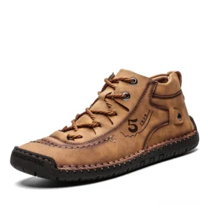 Men's gothic split leather ankle boots with hand-stitched details, three-quarter front view showing tan brown color and lace-up closure