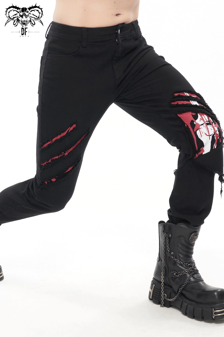 Gothic men's distressed ripped trousers lifestyle image showing alternative style and fashion aesthetic