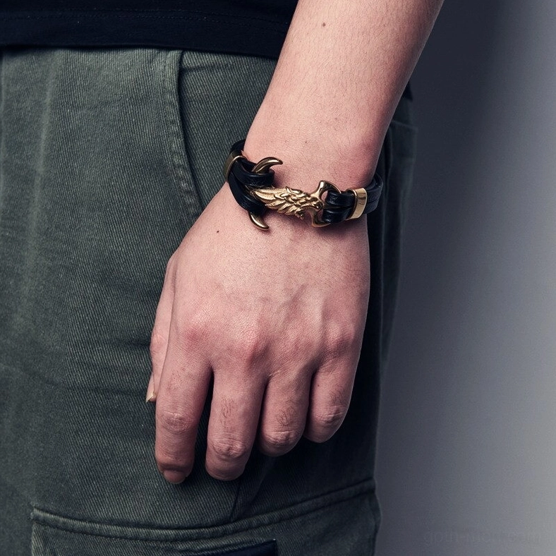 Men wearing gold-black gothic eagle bracelet on wrist with casual styling, demonstrating authentic wear and fit