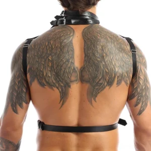 Black leather harness rear view showing back strap and neck collar construction on tattooed male model