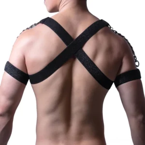 Black leather male harness rear view showing X-shaped crossed shoulder straps and adjustable back buckles, gothic bondage style