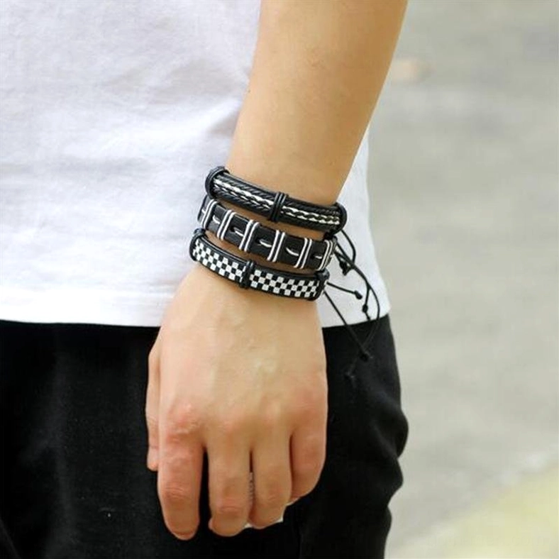 Men wearing stacked gothic leather bracelets casual street style outdoor