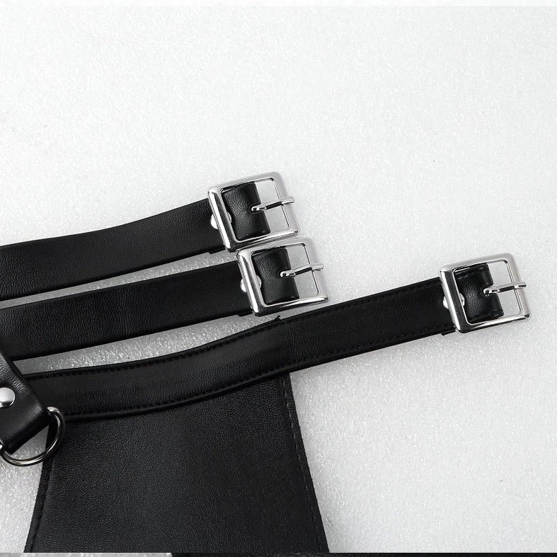 Men's gothic faux leather body harness assembled flat lay showing complete design and metal hardware