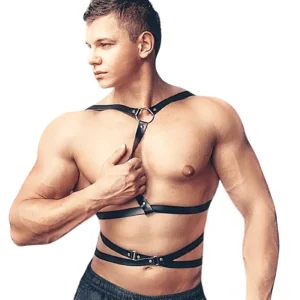 Men's gothic leather chest harness with metal O-rings front three-quarter view on athletic model, black faux leather with adjustable shoulder and waist buckles