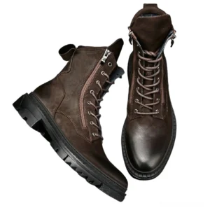 Men's motorcycle combat boots side angle showing thick lug sole and heel pull tab