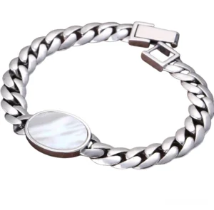 Sterling silver men's gothic bracelet featuring oval shell inlay charm with polished Cuban link chain