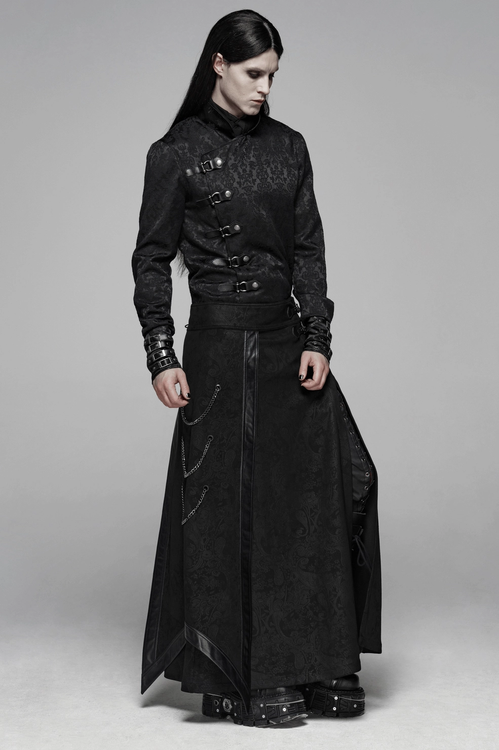 Gothic men's long overskirt model wear showcasing fitted cut and chain embellishments
