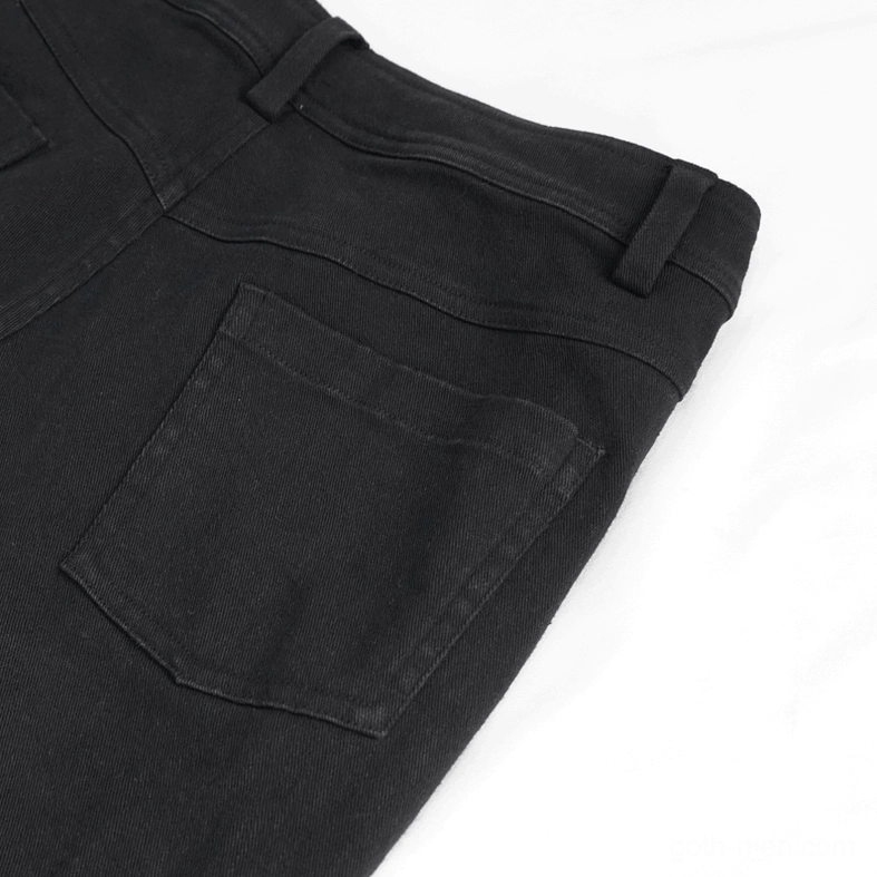 Men's gothic ripped pants detail shot highlighting frayed distressed edge and interior graphic print elements
