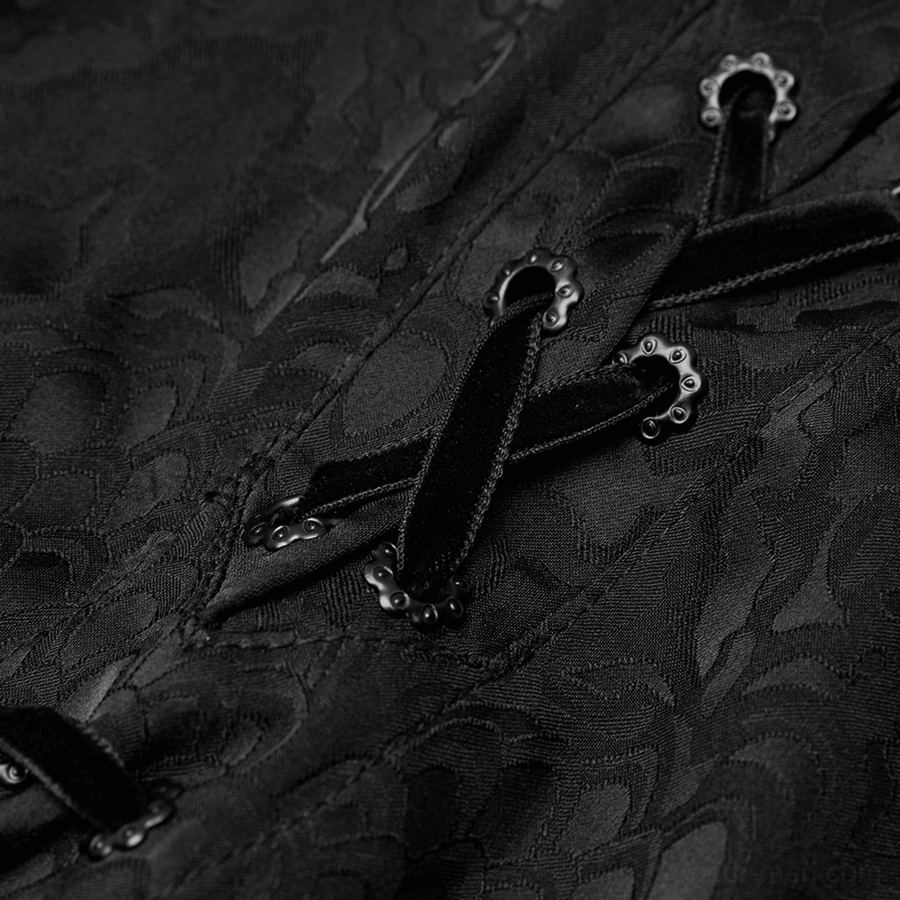Close-up of velvet lace-up neckline with ornate metal eyelets and damask jacquard fabric detail
