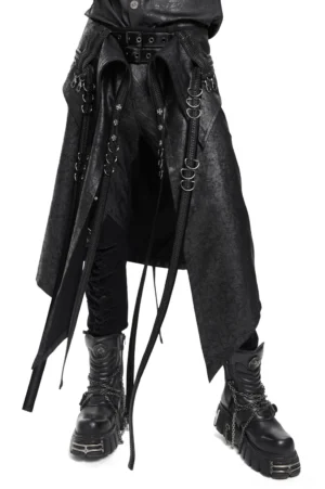 Male model wearing black gothic layered strap skirt with metal D-rings and zipper details, front full-body view