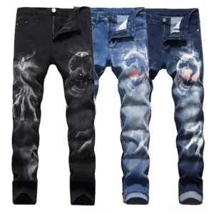 Men's gothic skull print stretch jeans in black, navy, and light blue - flat lay overhead view showing 3D skull and ghost hand prints