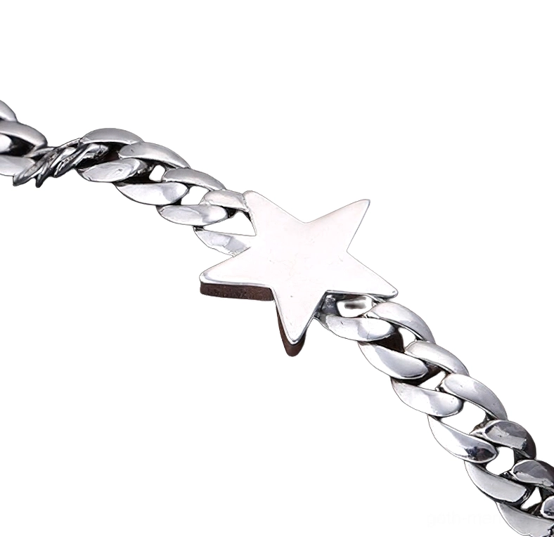 Detailed close-up of five-pointed star charm on men's gothic silver bracelet showing chain link craftsmanship