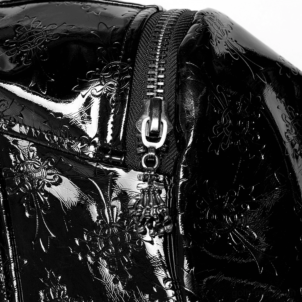 Detail shot of gothic trench coat zipper pull mechanism and embossed patent leather texture