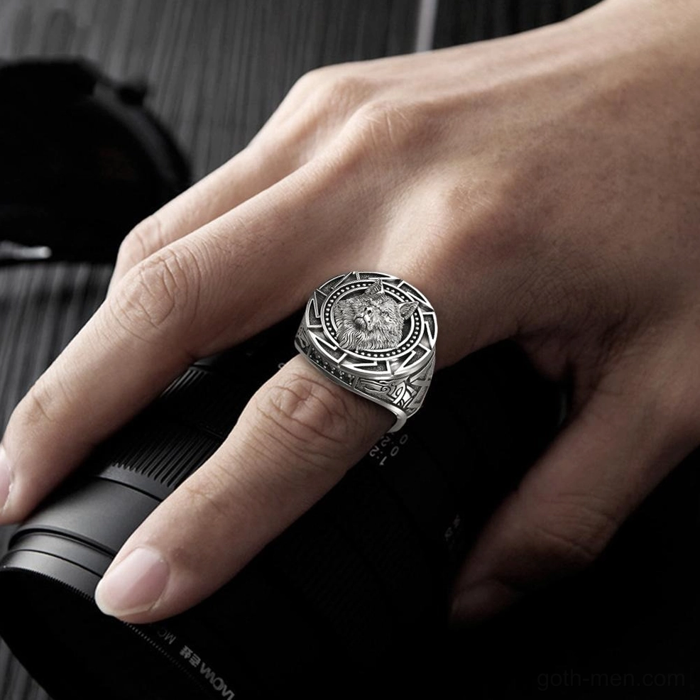 Men's casual gothic wolf ring on male hand wearing side view, vintage silver finish with camera prop backdrop