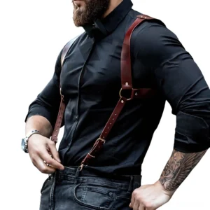 Men's brown leather body harness with adjustable metal buckles - left side profile view showcasing chest strap and shoulder design