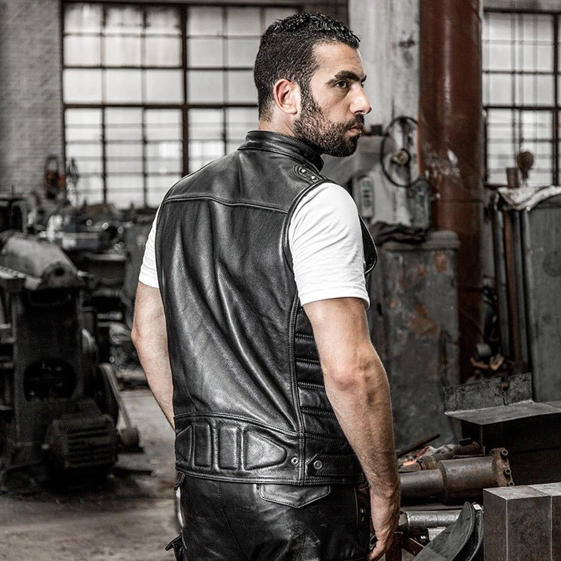 Professional photograph of genuine leather motorcycle biker vest on male model from side angle