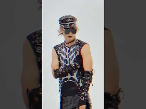 Male model wearing black skeleton gothic tank top with punk accessories styled look