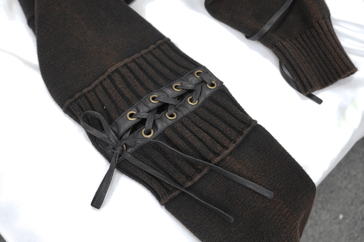 Flat lay detail view of black gothic hooded sweater showing ribbed cuff construction and knit texture quality