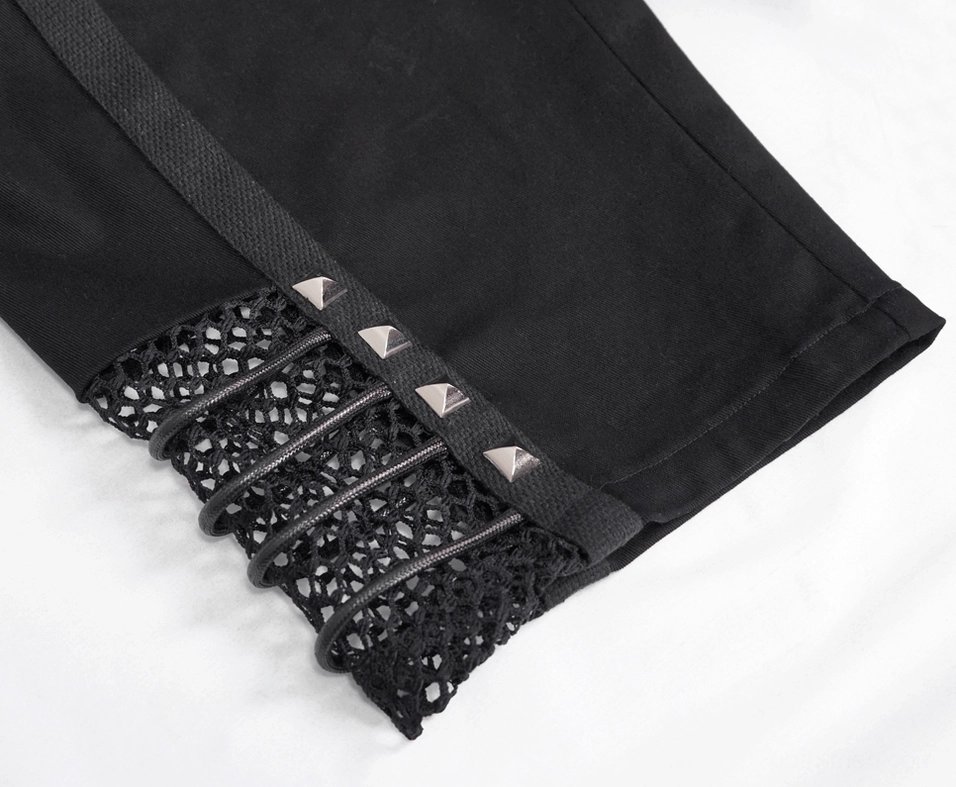 Fishnet panel detail of gothic punk shorts showing rivet accents and woven strap