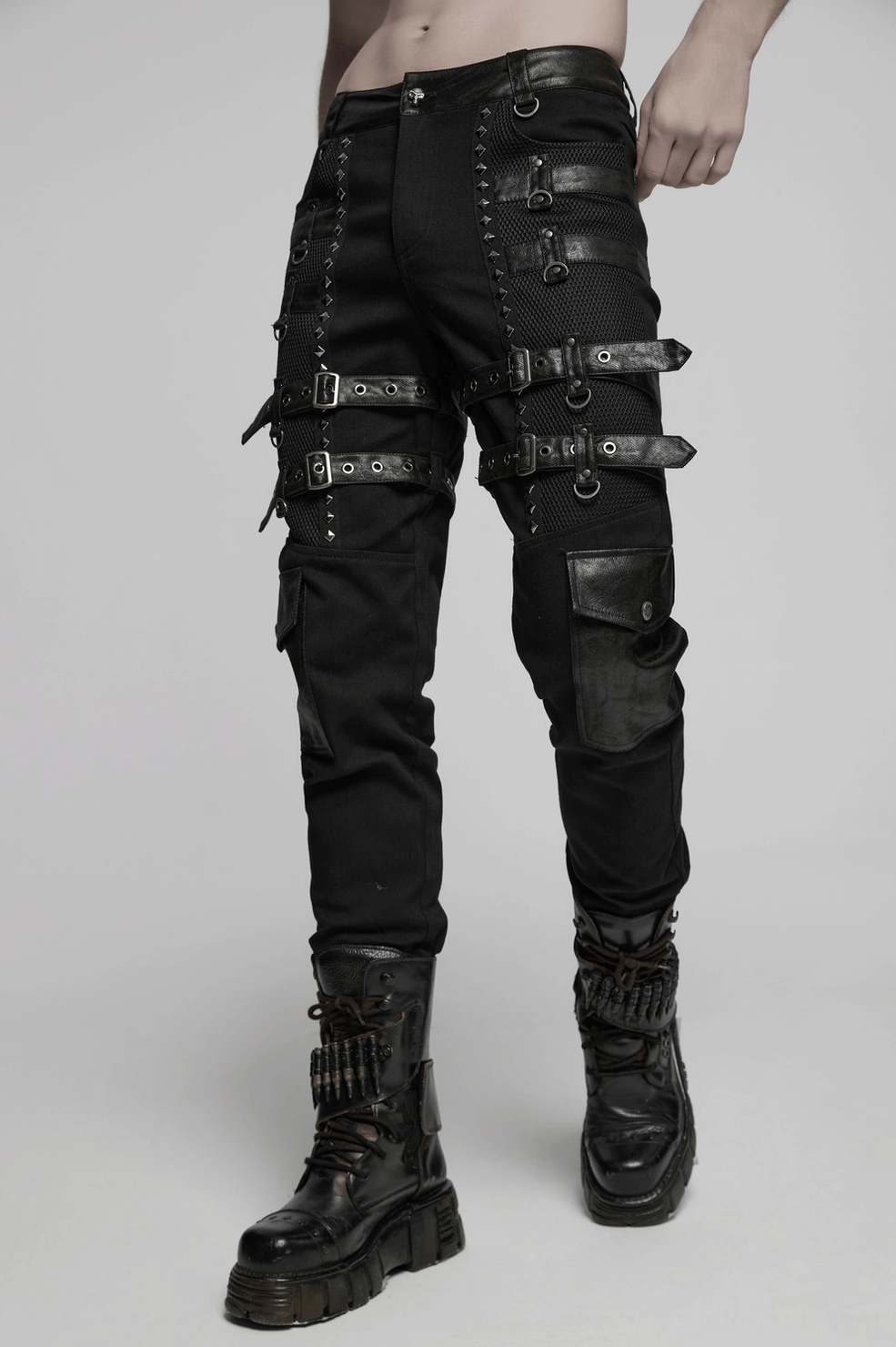 Dark view of metal studded gothic pants highlighting pyramid studs, buckles, and punk aesthetic edge