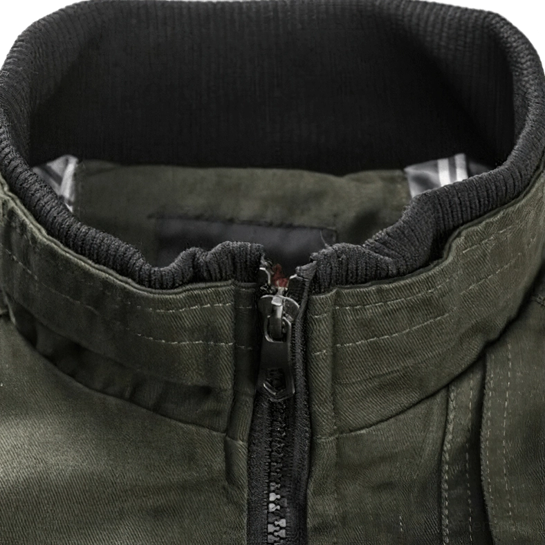 Close-up detail of military bomber jacket collar and heavy-duty metal zipper - ribbed knit collar with olive green cotton fabric texture