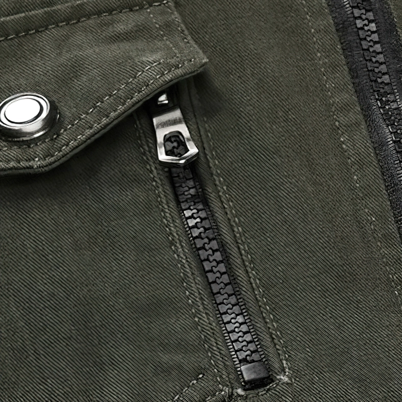 Close-up detail of military bomber jacket pocket with snap fastener button and metal zipper - olive green cotton fabric construction