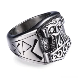 Mjolnir gothic biker ring with Thor's hammer design in 316L stainless steel, left three-quarter view showing aged Norse rune engravings