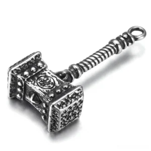 Mjolnir Viking hammer pendant - left oblique side view showcasing twisted handle and embossed Norse patterns in vintage stainless steel