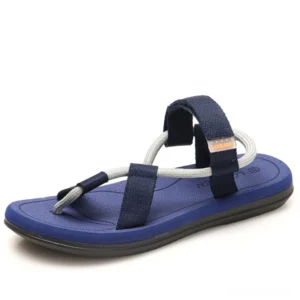 Navy blue gothic sandals with dual-tone webbing straps, minimalist gladiator style, overhead angle