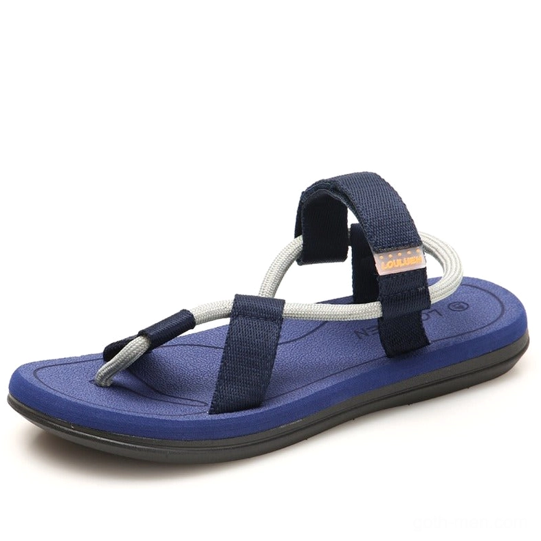 Navy blue gothic sandals with dual-tone webbing straps, minimalist gladiator style, overhead angle
