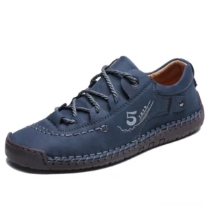 Navy blue gothic casual leather loafers with lace-up closure, studio photography side angle showcasing matte finish leather