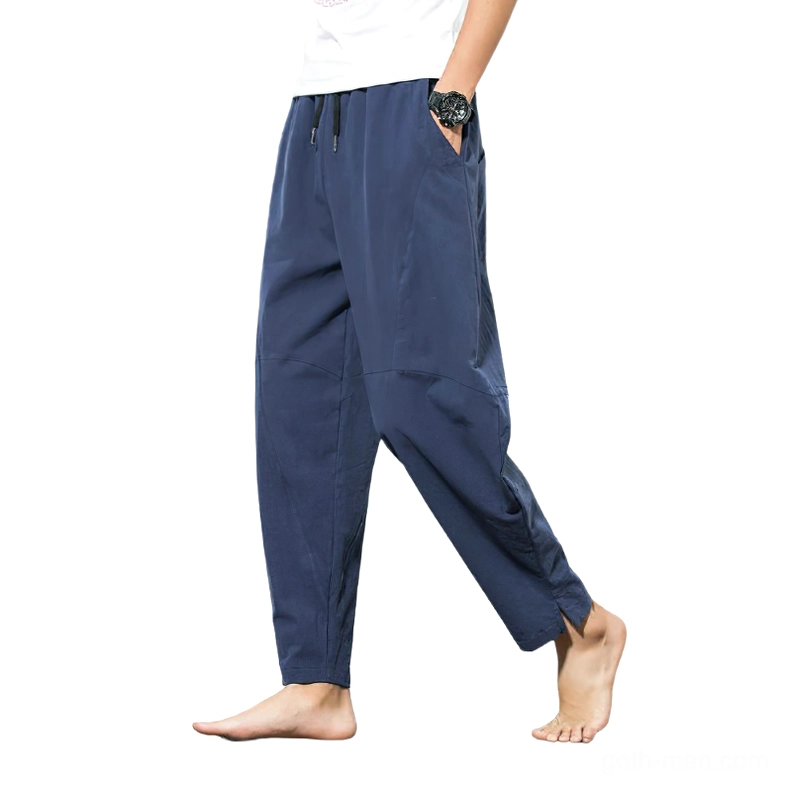 Navy harem pants side view showing split ankle hem and relaxed silhouette